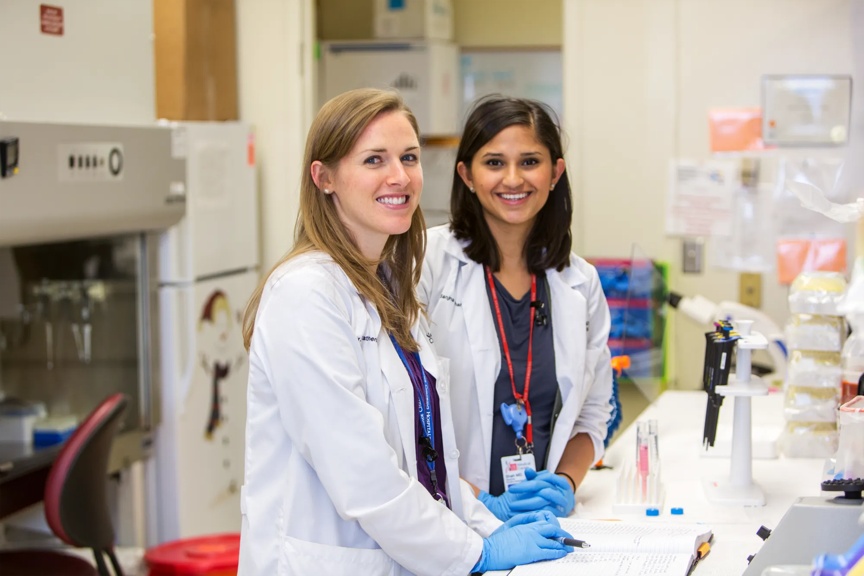 Two providers working in a lab.