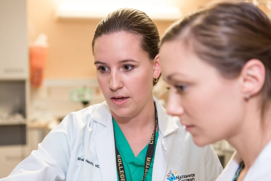 Two providers reviewing information.