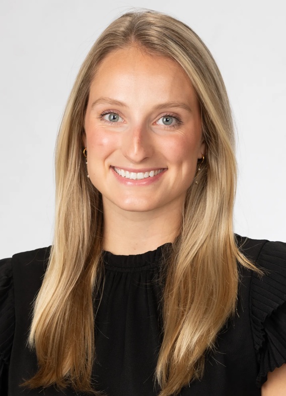 Portrait of Audrey Davis, woman with long blonde hair and a black shirt.