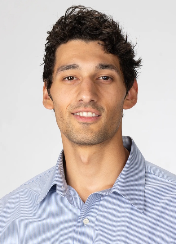 Portrait of Sergio Steven Cobos, man with short brown hair and a blue shirt.