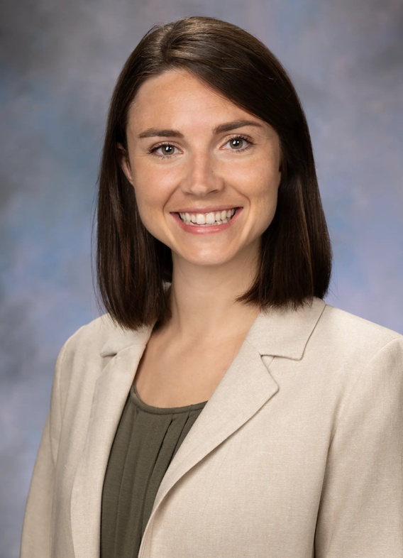 Portrait of Madison Dudon, woman with short brown hair and a light brown blazer.