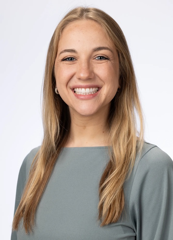Portrait of Katherine Wilcher, woman with long blonde hair and a grey shirt.