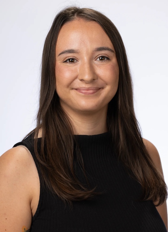 Portrait of Meriah Parker, woman with long brown hair and a black shirt.