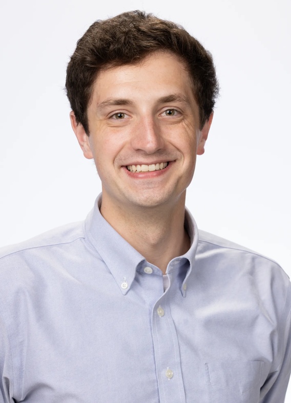 Portrait of Noah Worobitz, man with short brown hair and a blue shirt.