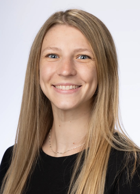 Portrait of Stephanie Cox, woman with long blonde hair and a black shirt.