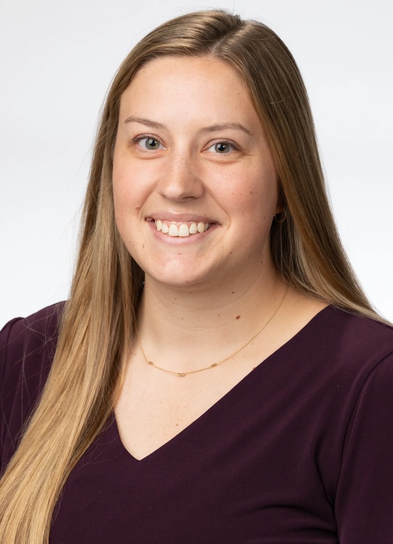 Portrait of Kolbie Chancellor, woman with long blonde hair and a black shirt.