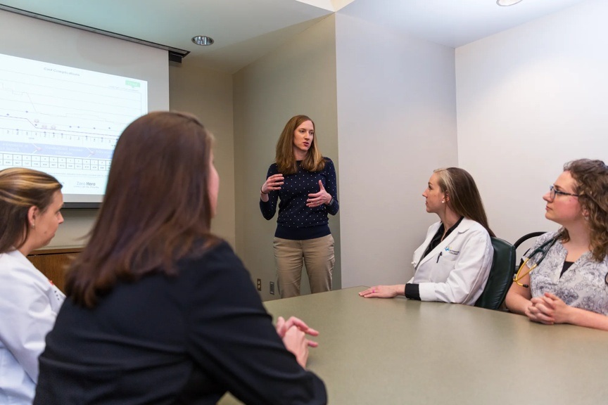 One provider is presenting to a group of colleagues.