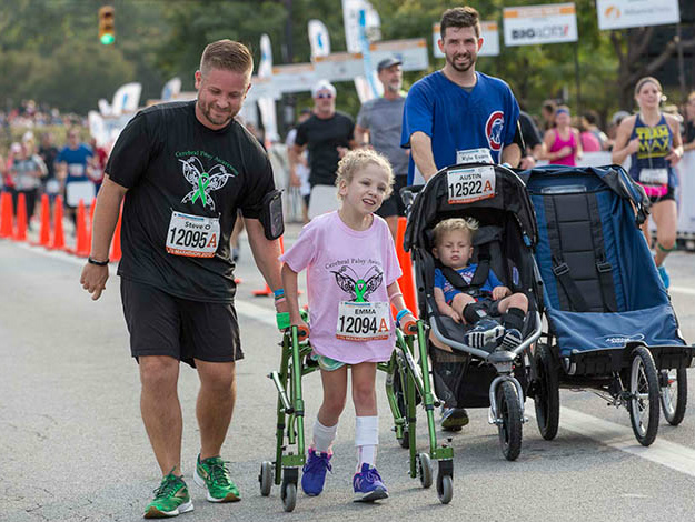 Emma crossing finish line