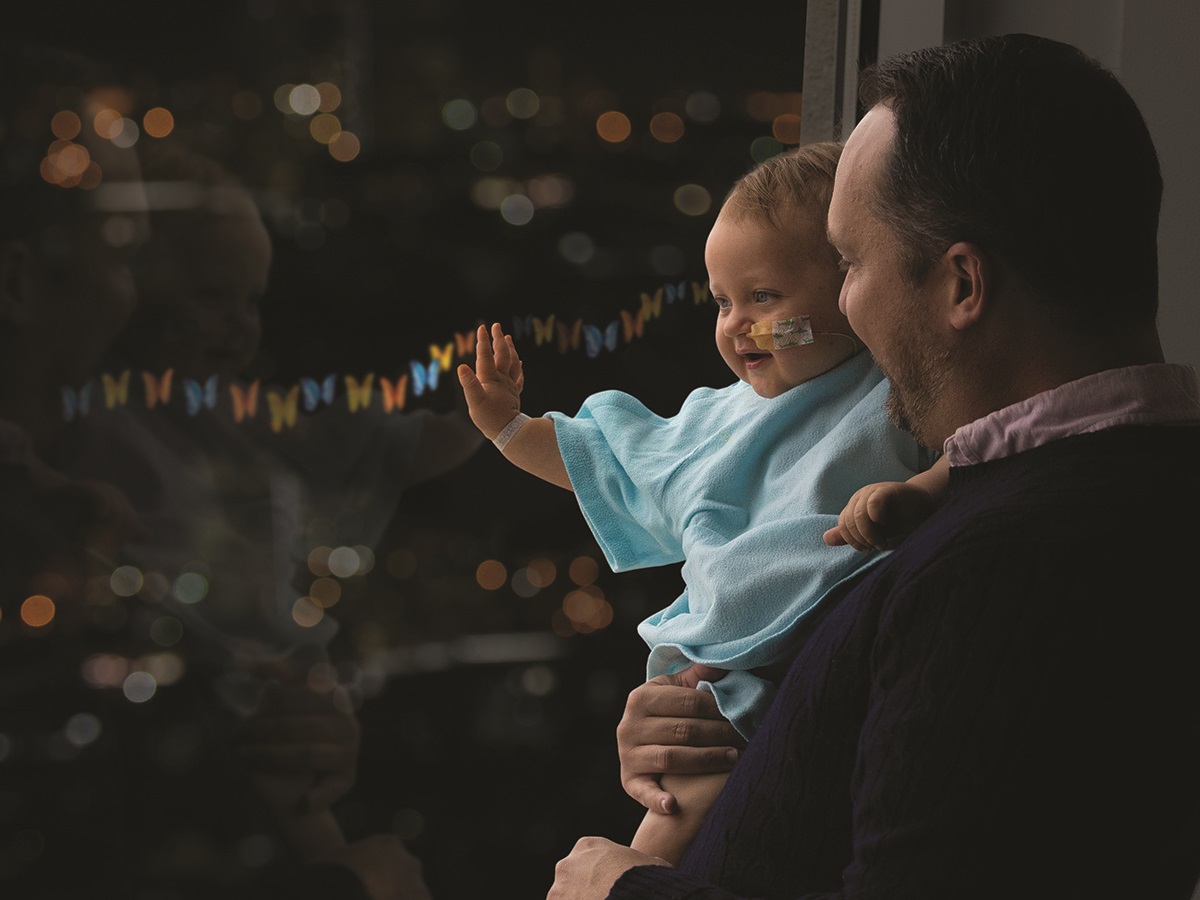 Callahan with his dad looking out the window