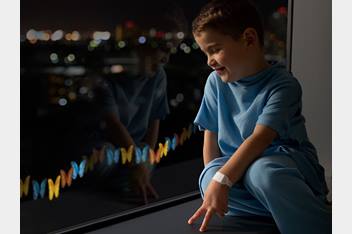 Knox looking at the lit butterflies