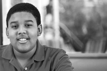 Smiling teen boy in cafeteria