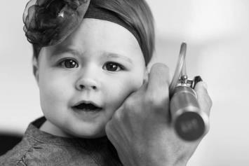 Child having ear examined