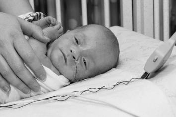 NICU baby in isolette