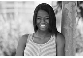 Teenage Girl Leaning on Tree Smiling