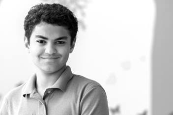Teen Boy Smiling in Hallway