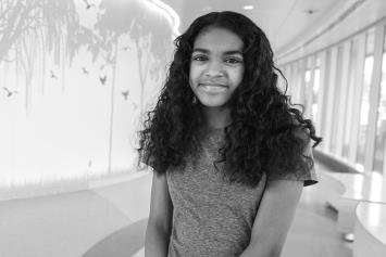 Teen Girl Shy Smile in Hallway