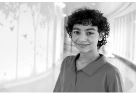 Preteen Boy Smirking in Hallway