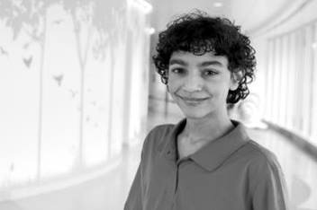 Preteen Boy Smirking in Hallway