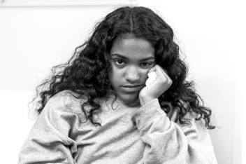 Mildly Ill Girl Sitting in Waiting Room