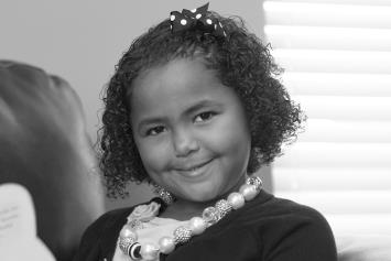 Young Girl Reading on Couch
