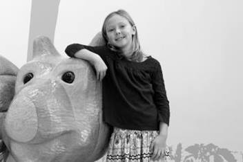 Girl Standing Next to Caterpillar Animal Friend