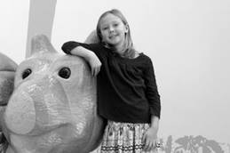 Girl Standing Next to Caterpillar Animal Friend