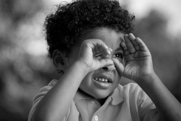 Young Boy Cupping Hand