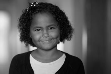 Young Girl Smiling in Hallway