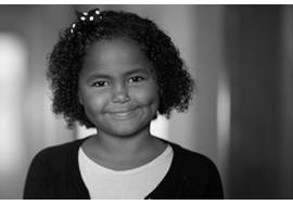 Young Girl Smiling in Hallway