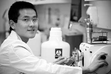 Male researcher using medical equipment