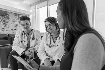 Doctors meeting in hallway area
