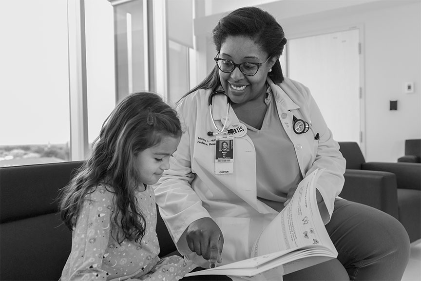 Resident reading with child
