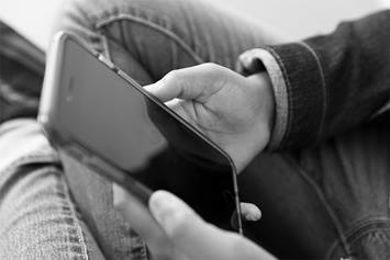 Child holding cell phone