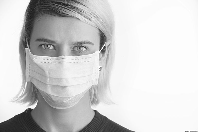 Female health care provider wearing a face mask