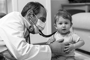 Dr. Mendell with patient