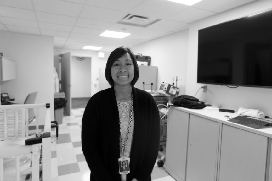 Mary is shown standing in a clinical setting at Nationwide Children's