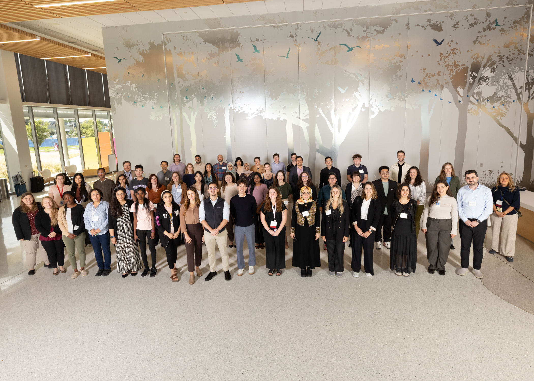 Large group of people smiling at the camera.