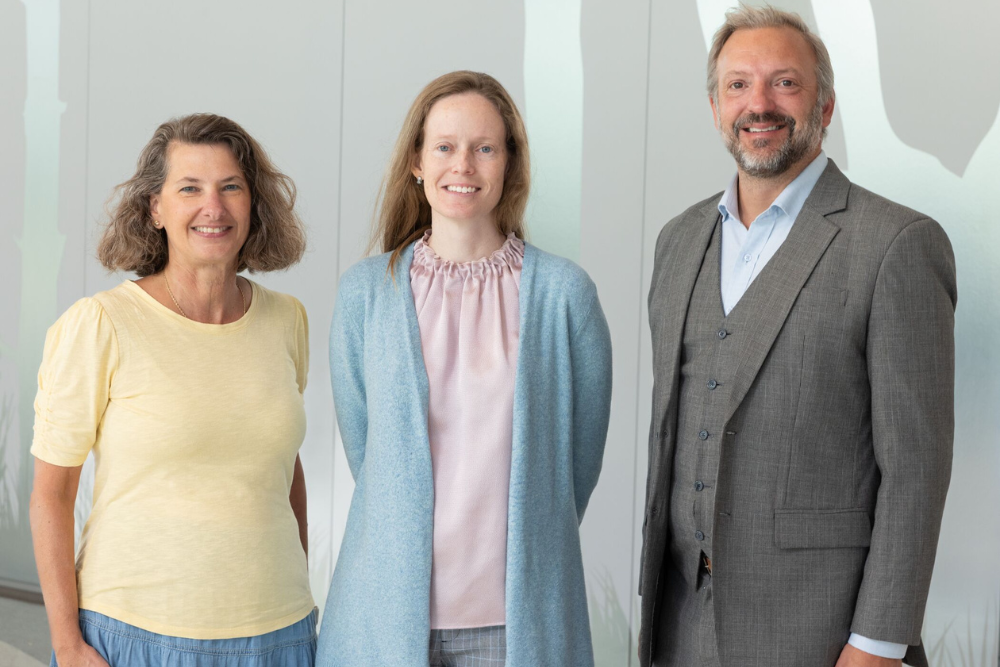 Three medical professionals posing for a photo.