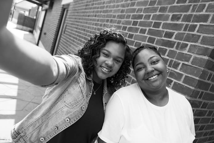 Two Teen Girls Talking a Selfie