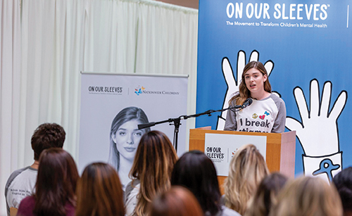 Julia speaking at On Our Sleeves event