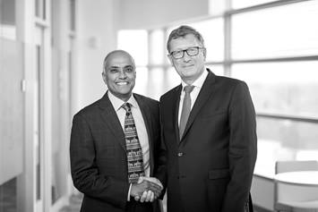 Dr. Cuckow and Dr. Jayanthi shaking hands